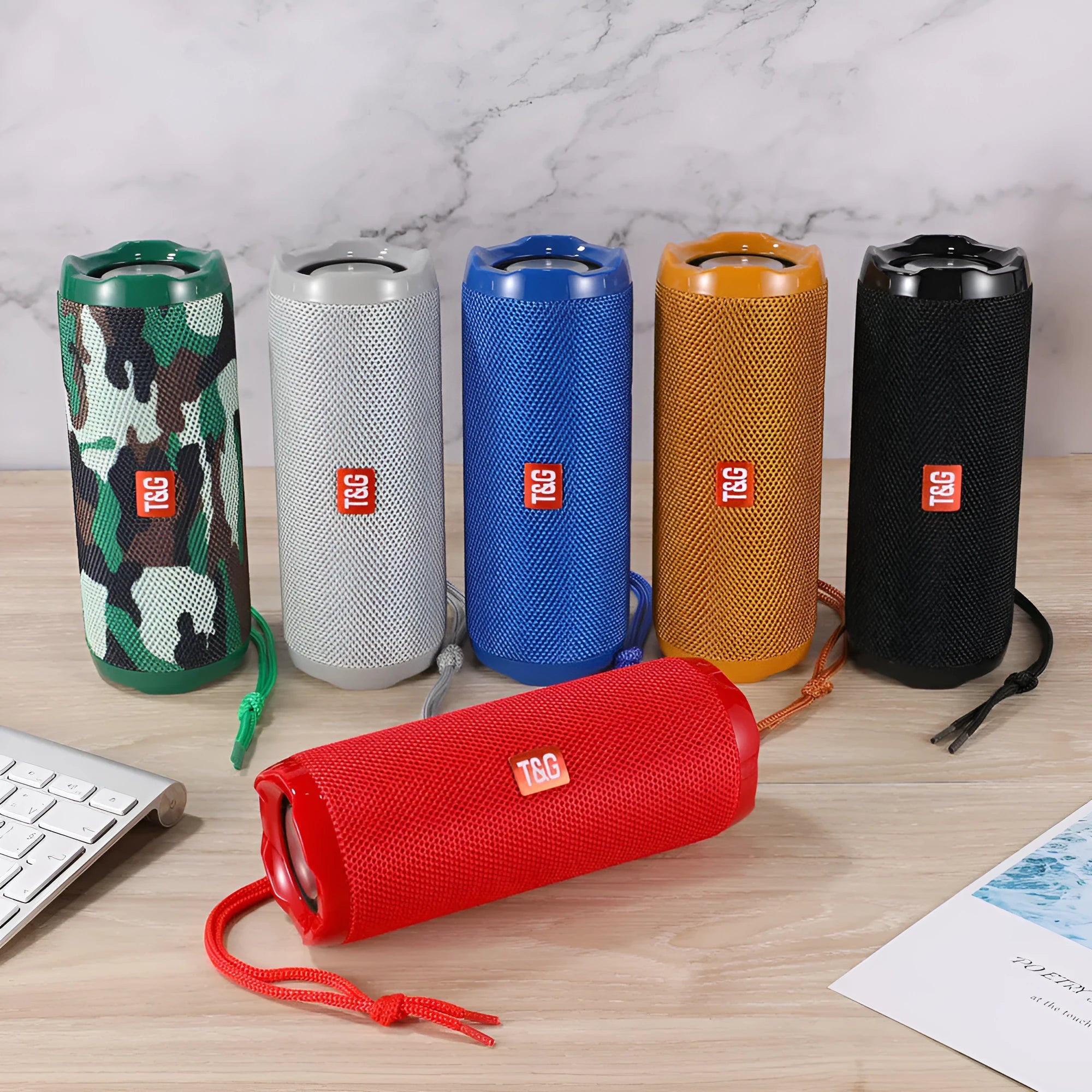 Fabric-covered portable Bluetooth speaker with integrated card holder in one of six colour options.
