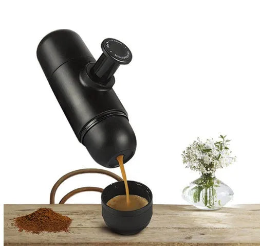 Black portable manual coffee machine measuring 6cm by 17.5cm with stainless steel components