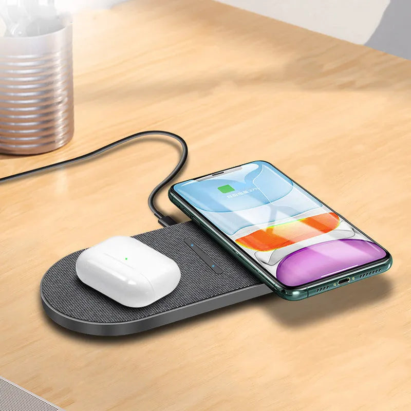 A pair of black 10W dual wireless charging stands on a desk.