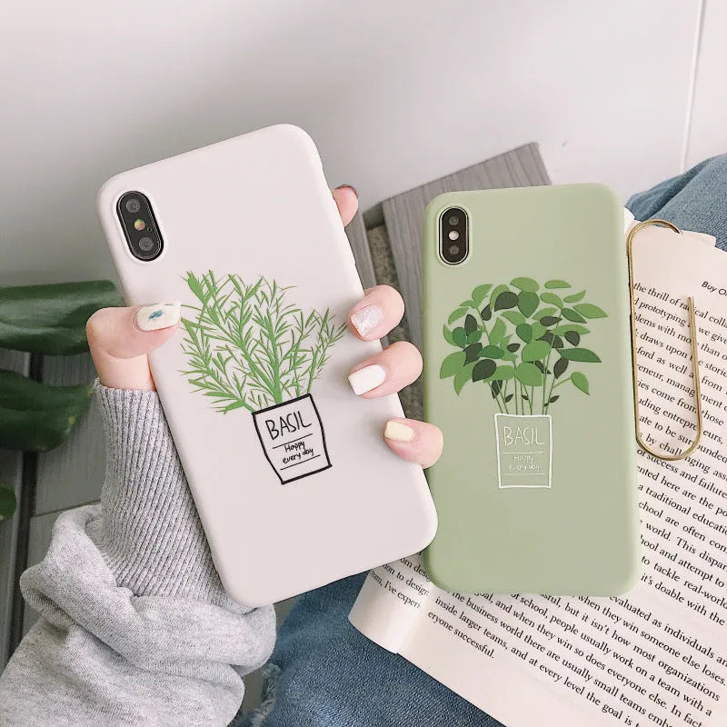 White silicone iPhone case with painted plant design showing 360-degree edge protection