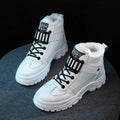 Ladies snow boots in black with artificial PU upper, flat heel, round toe, and front tie laces