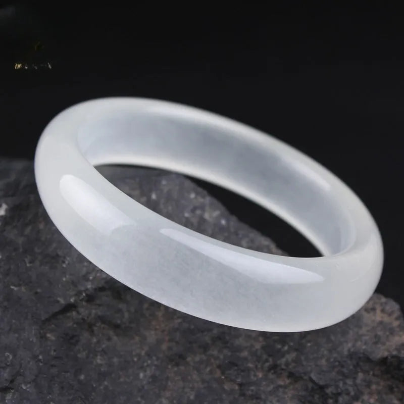 Gao bing jade bracelet in ice-white with flat rod and round rod style options on a wrist