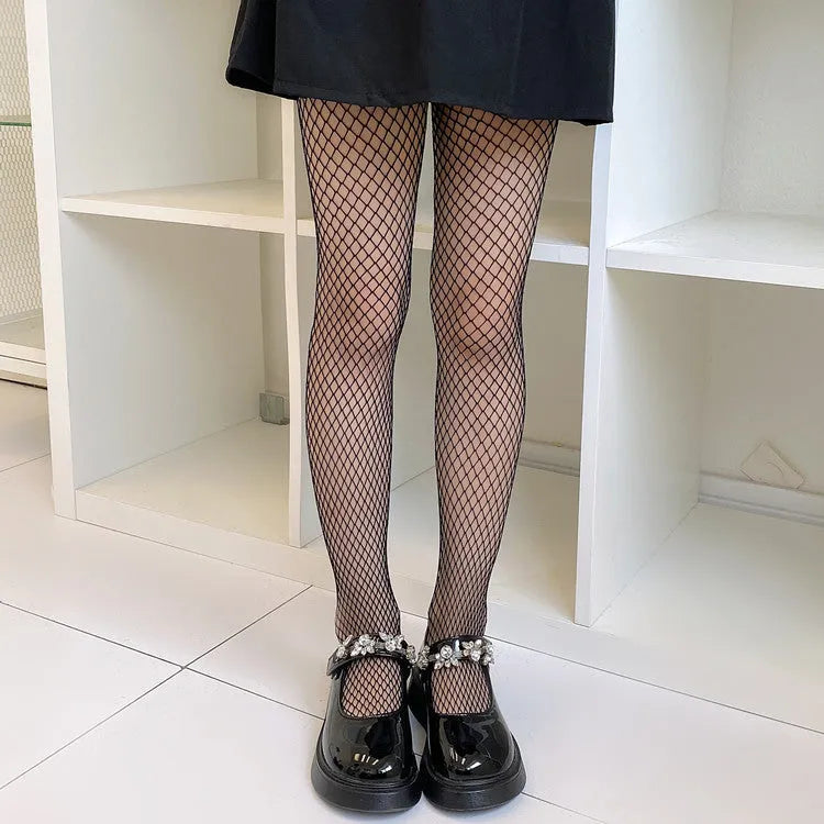 Women's mesh stockings showing large, medium and small hole patterns in black and white colours