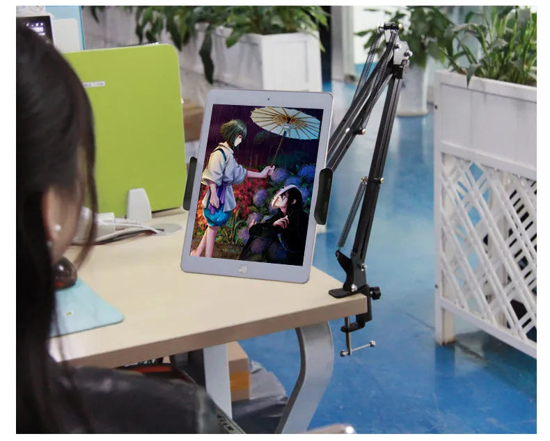 Adjustable phone and tablet stand in black and white colours on desktop
