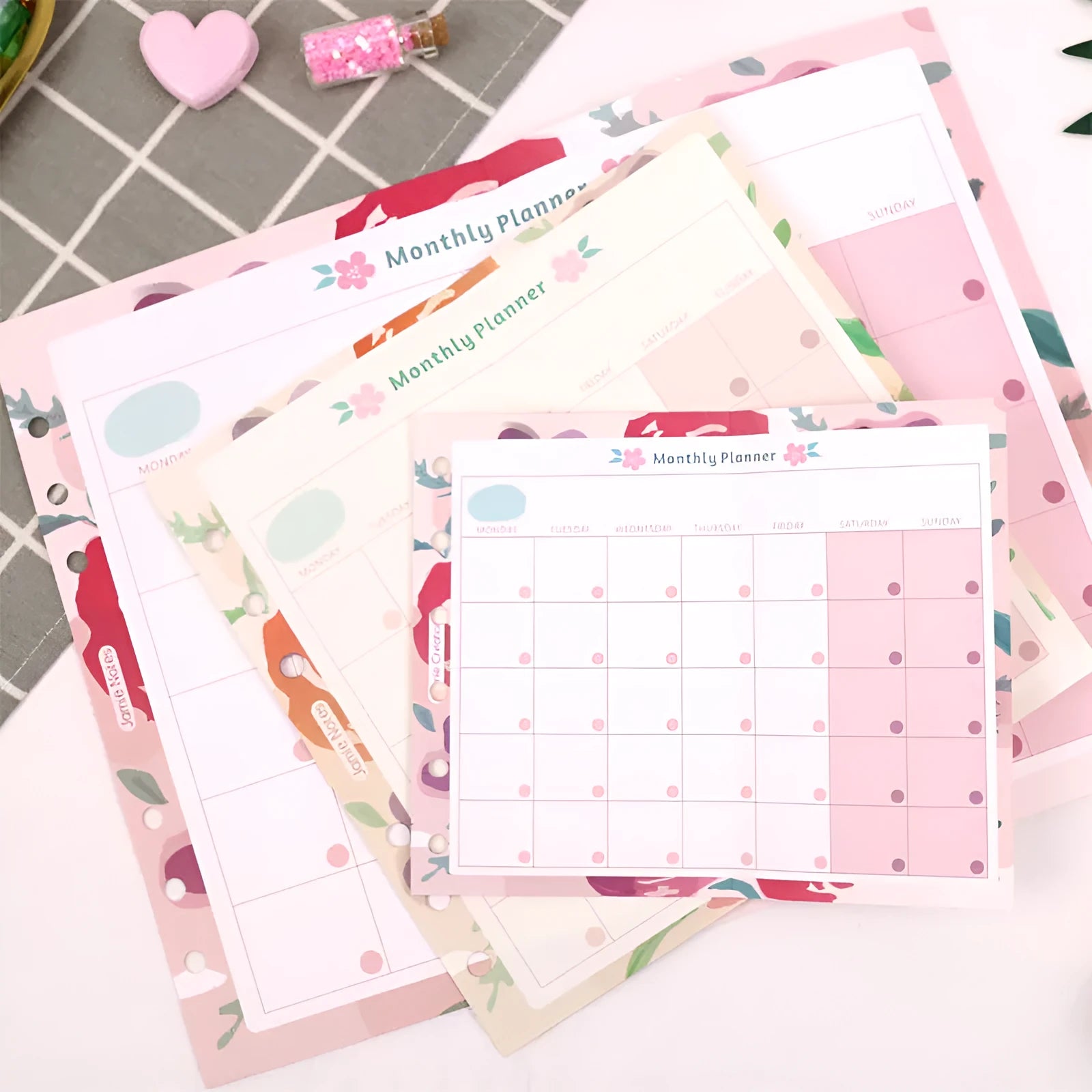Handbook loose-leaf refill showing floral monthly planner and Symphony tri-fold layouts in A5, A6, and A7 sizes