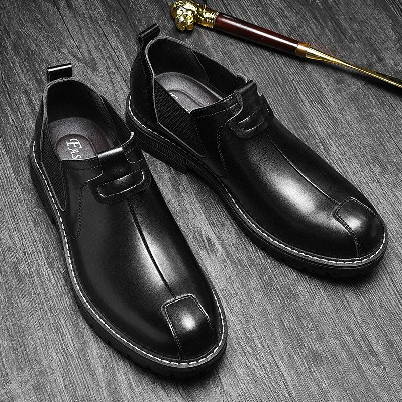 Men's black cowhide leather round toe loafers with rubber sole on a light background