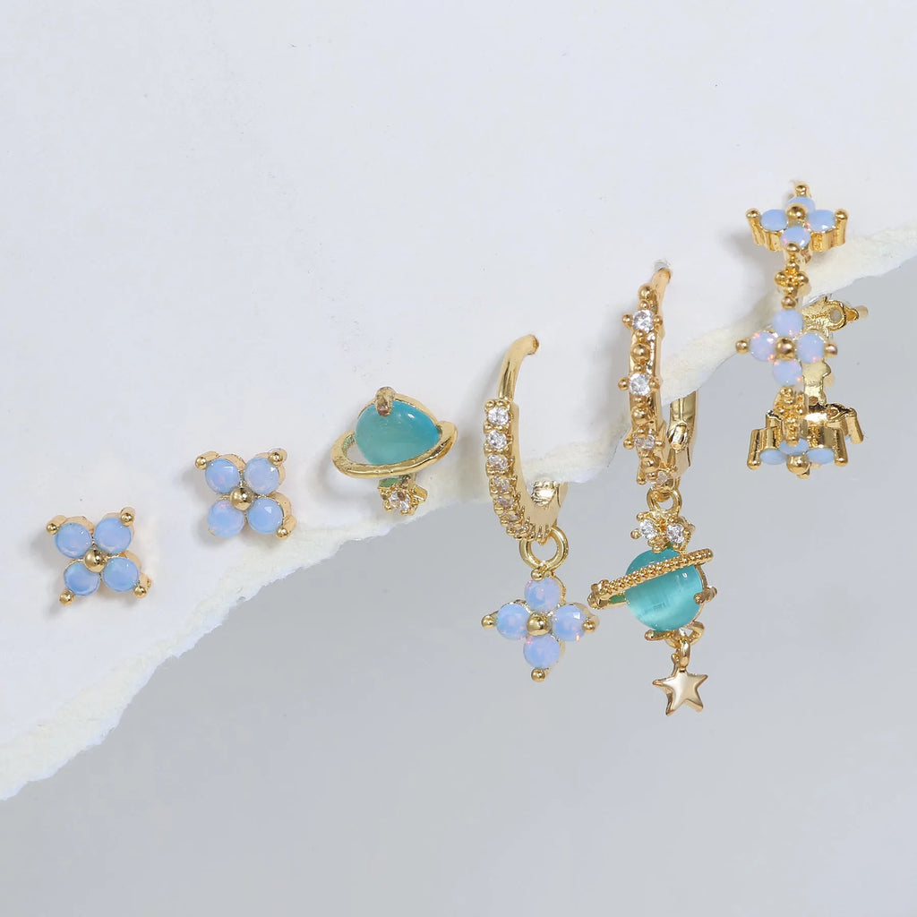 Gold and silver Japanese Korean style flower ear studs with zircon mosaic detail.