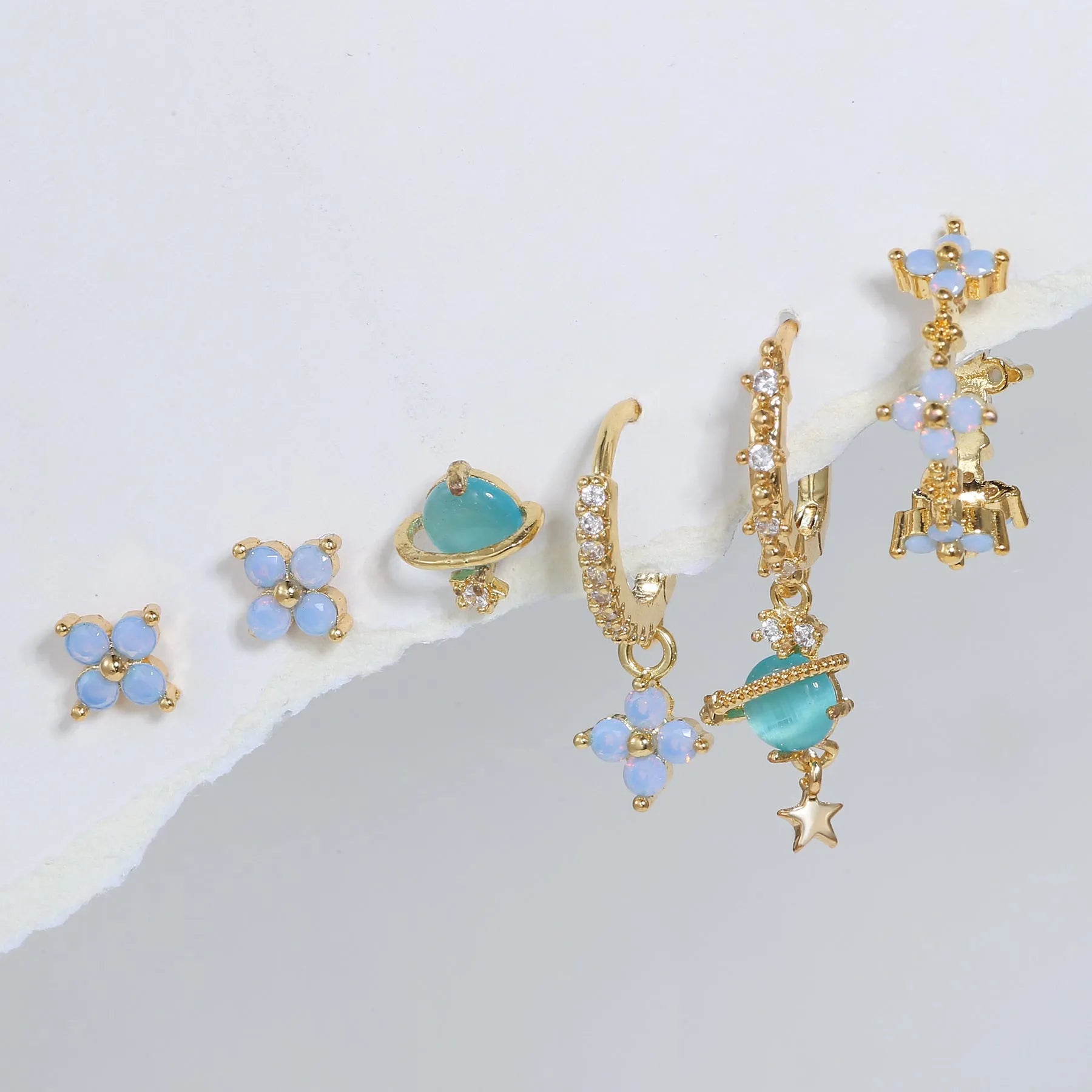 Gold and silver Japanese Korean style flower ear studs with zircon mosaic detail.