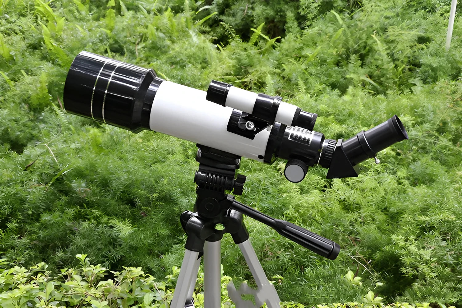 Dark blue children's astronomical telescope on a tripod with 16X to 66X magnification.