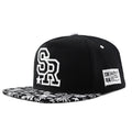 Adjustable cotton baseball cap in black or white with a dome crown.