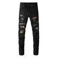 Men's black denim jeans with tattered hem and simple print patch detail