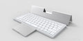 Black and grey wireless Bluetooth keyboard with touch pad next to its leather sheath stand for a tablet.