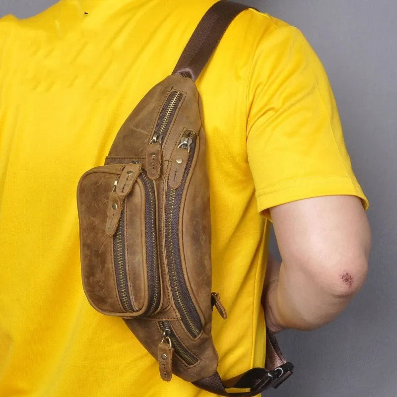 Brown leather retro messenger bag with shoulder strap showing front flap and buckle.
