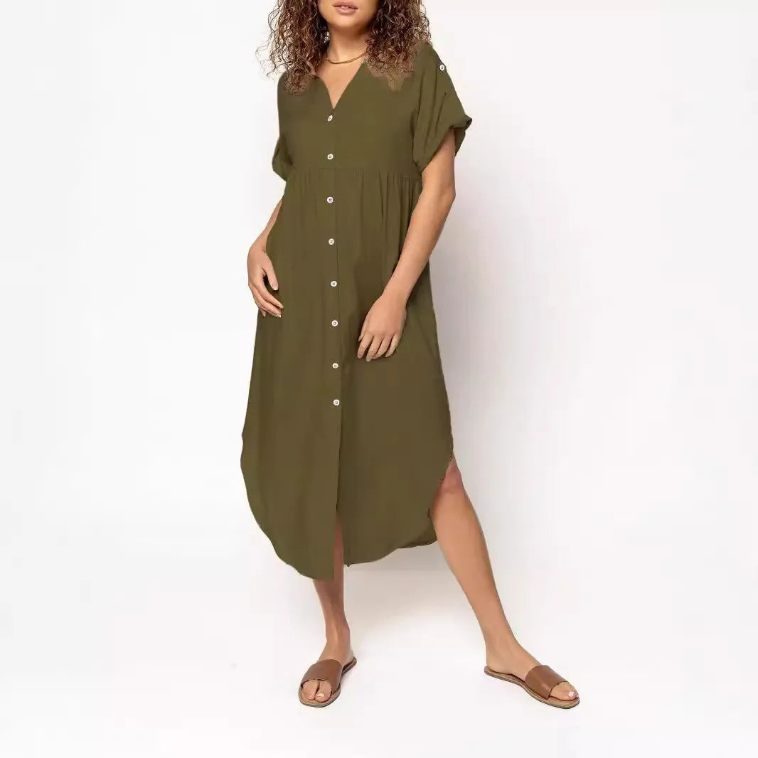 A solid colour mid-length casual dress with a button-down front and regular sleeves on a hanger.