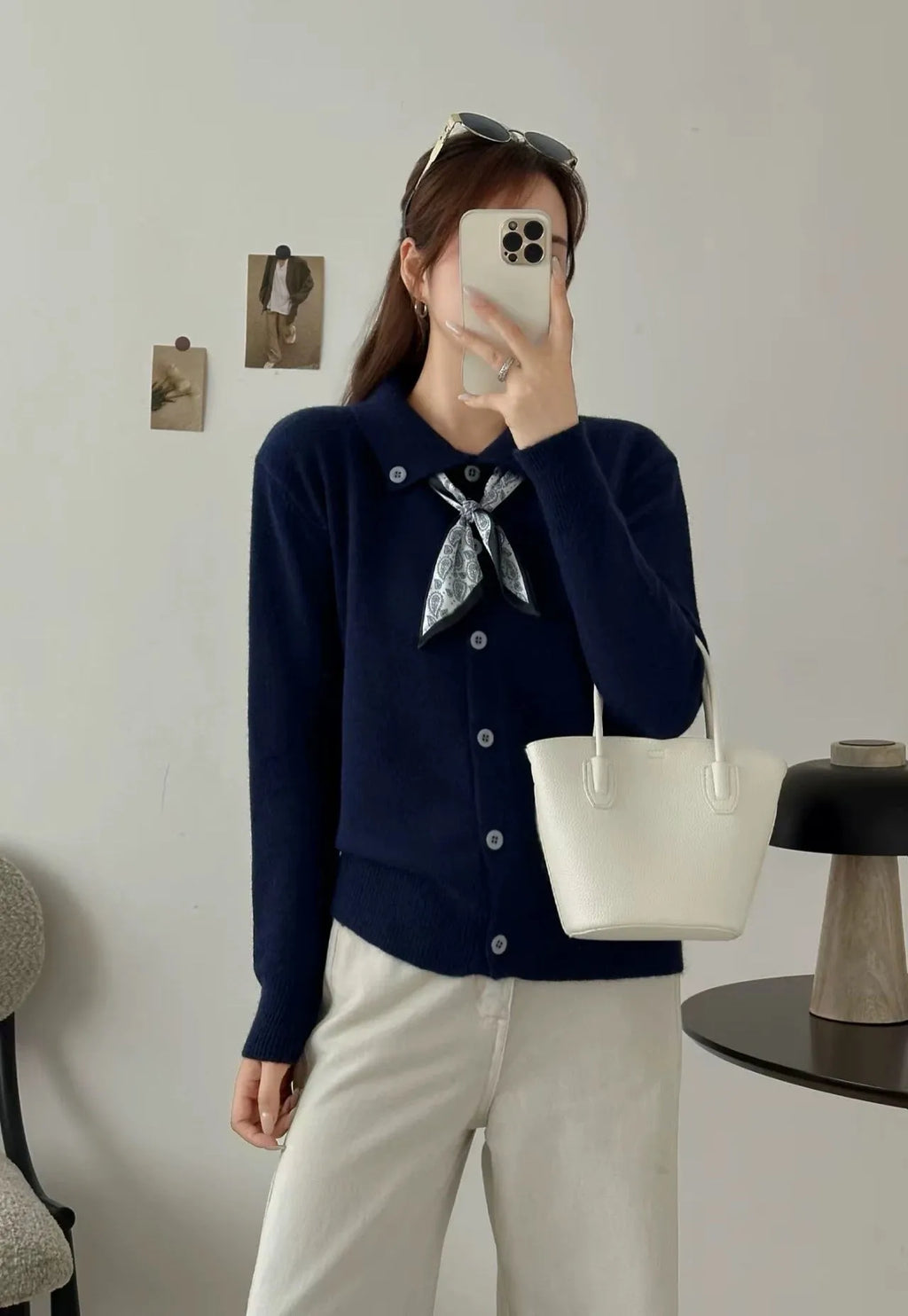 Acrylic fibre lazy fashion cardigan sweater with integrated lapel scarf in a neutral colour.