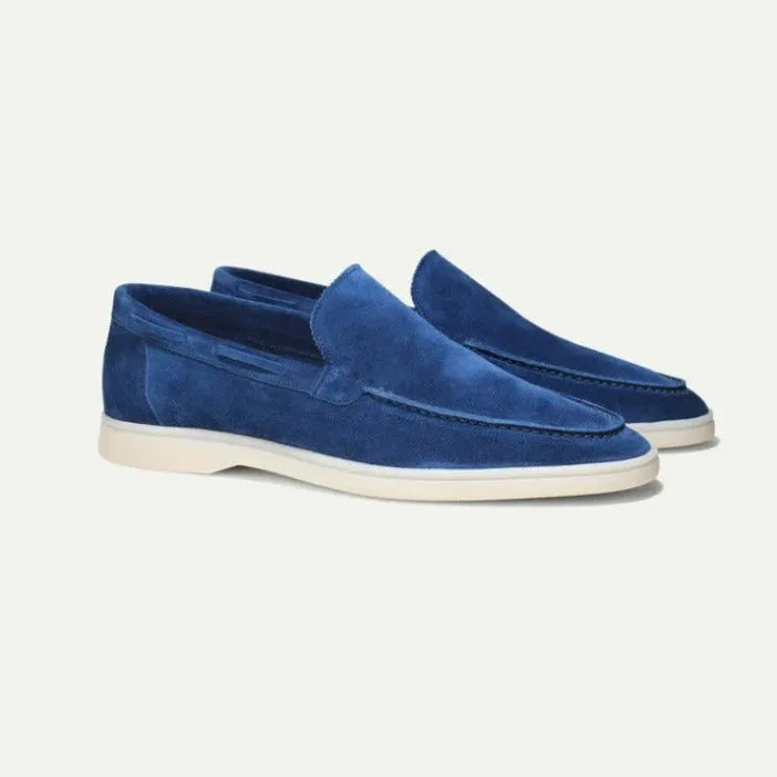 Men's matte suede flat shoes in sky blue with round toe and rubber sole on a plain background