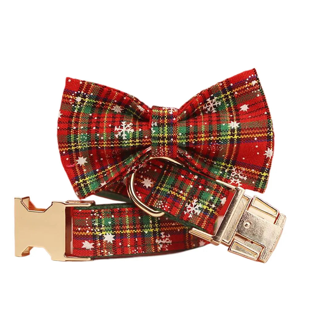 Green fabric Christmas pet collar and leash set with snowflake pattern, including a vest and decorative bow.