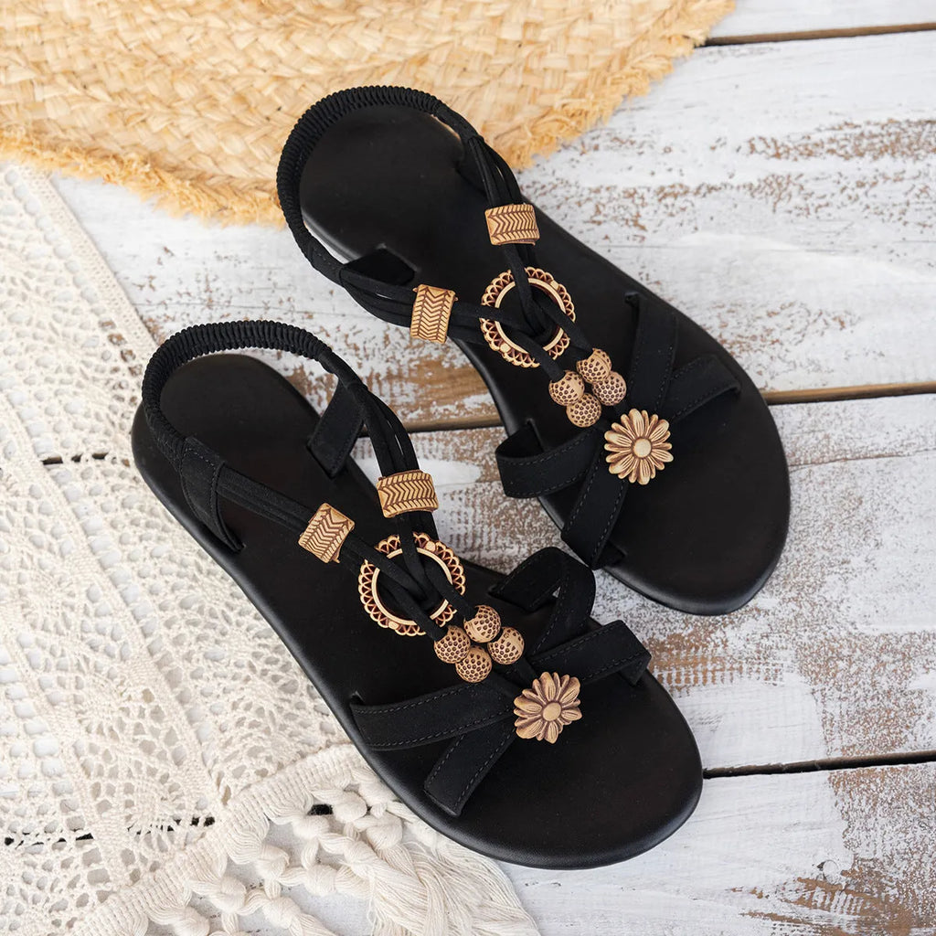 Black ethnic style women's flat beach sandals with beaded weave upper and open toe design