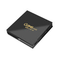 Q96 MAX S905 Android 4K TV Box set-top unit with remote control on a table.