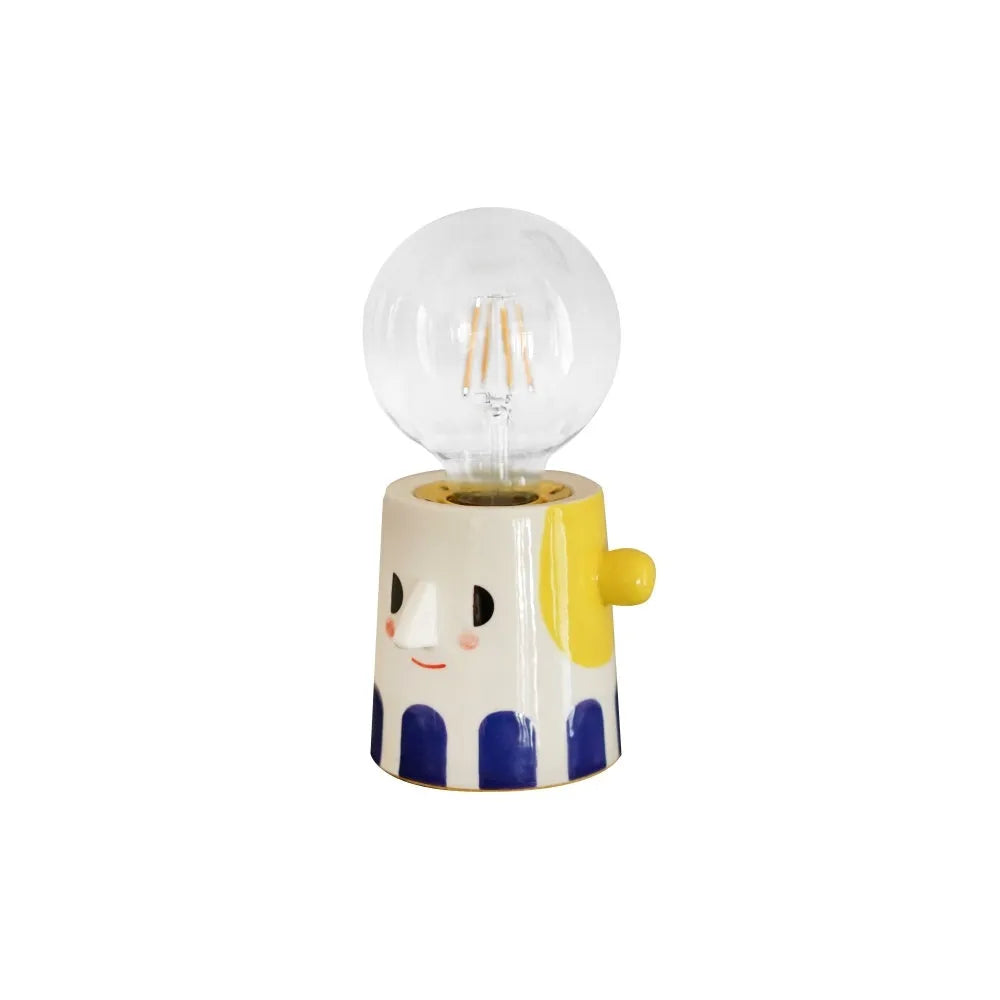 Handmade ceramic bedside lamp with a spherical ball headlight design on a ceramic base.