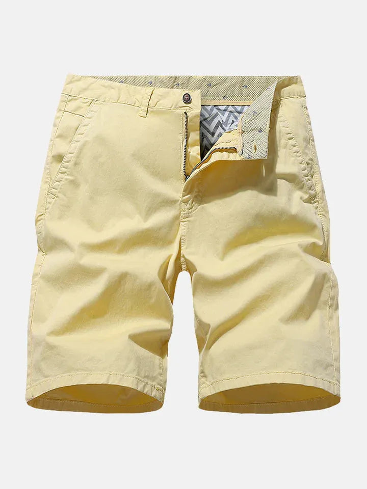 Men's loose blue denim shorts with a straight leg cut on a plain background.