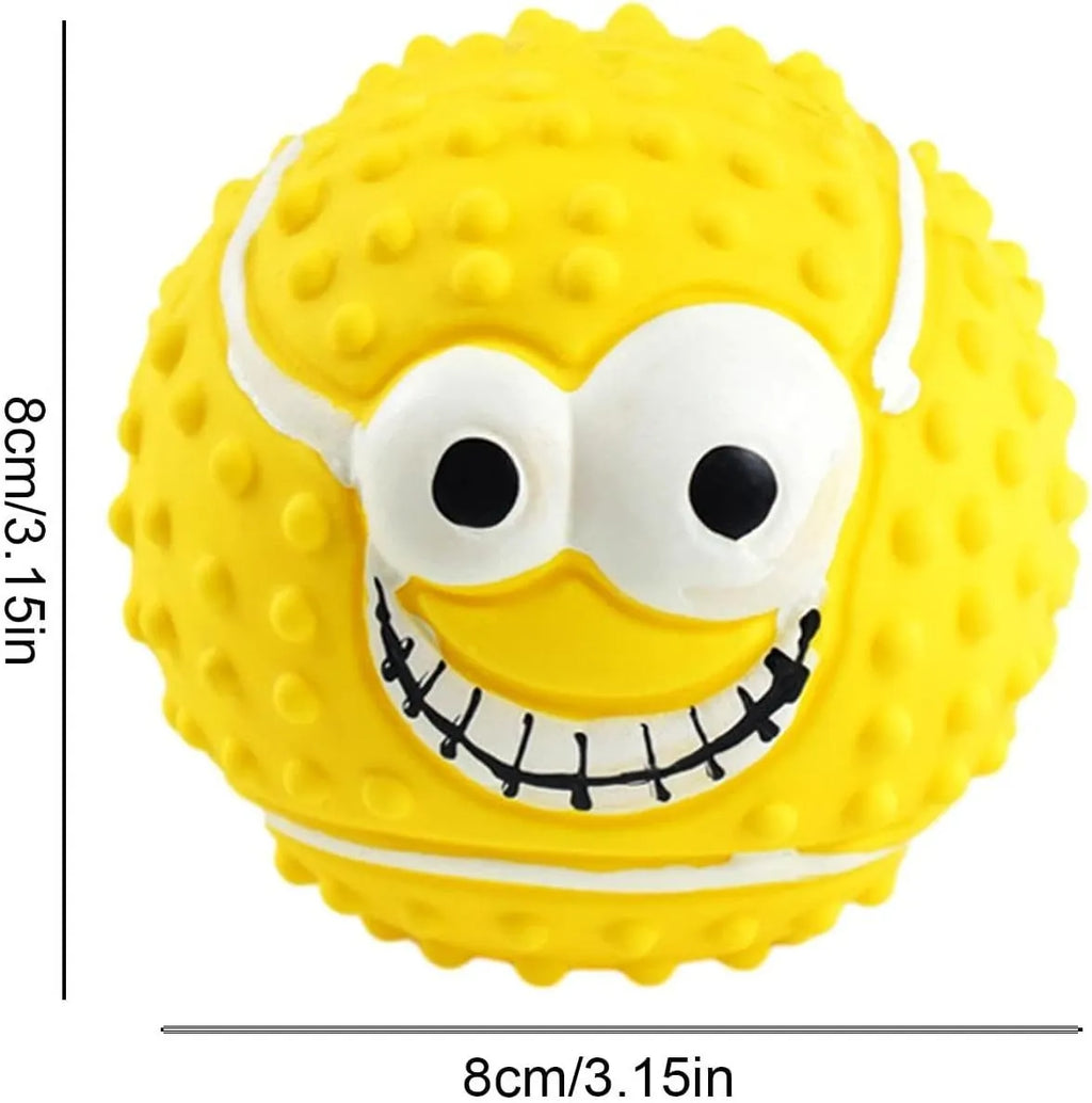 Green, orange, and yellow squeaky latex dog balls with smiley faces for pet play.