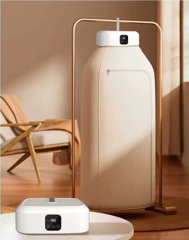 White cylindrical foldable laundry dryer with remote control for dormitory and small space use.