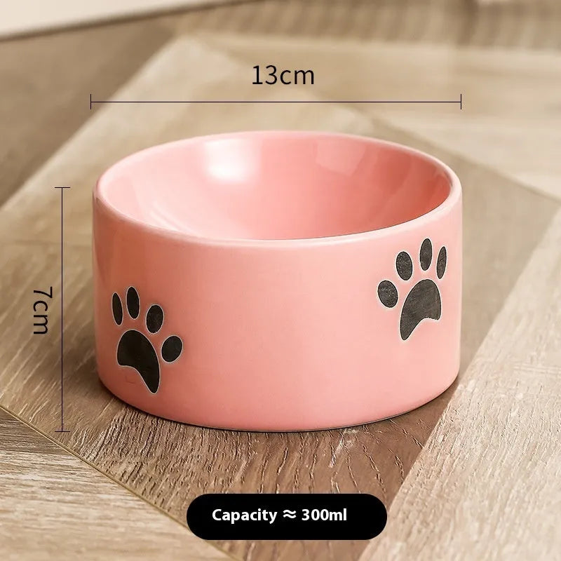 Ceramic cat food bowl with high foot design and cat's paw pattern in choice of colours