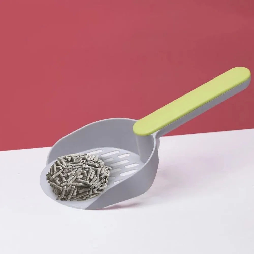 Blue plastic cat litter scoop with sifting holes for cleaning a litter box.