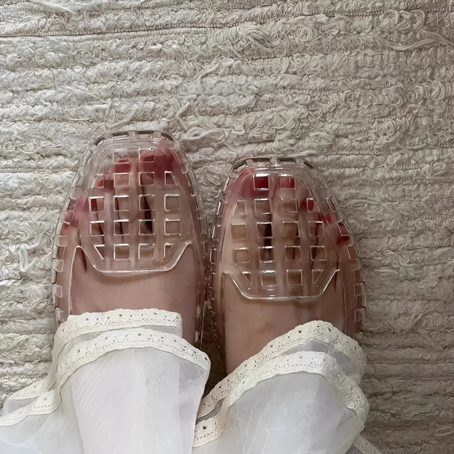 Women's transparent square toe PVC gel slipper on a neutral background, showing the distinctive toe shape.