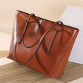 Women's retro style cowhide shoulder bag in horizontal square shape with multiple internal compartments