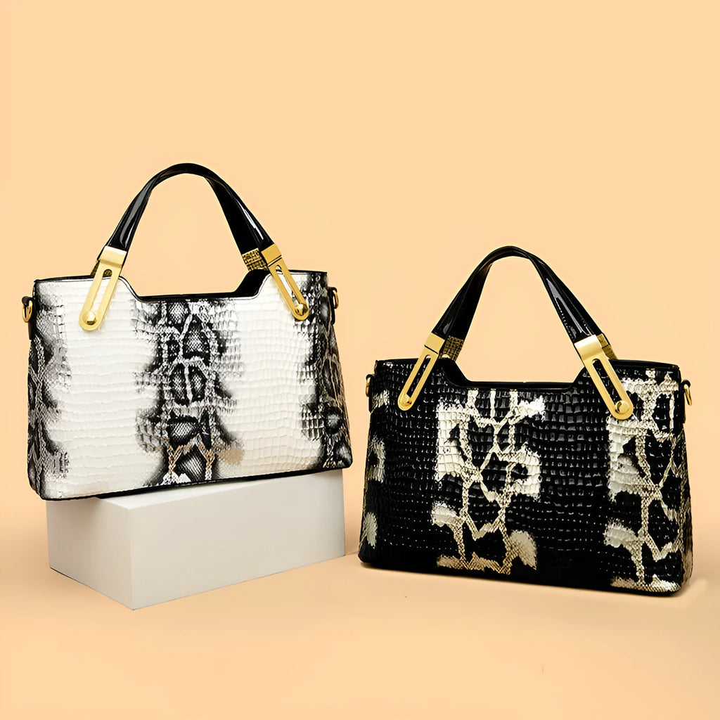 Retro black and white messenger bags with chain detail, showing internal phone and file compartments.