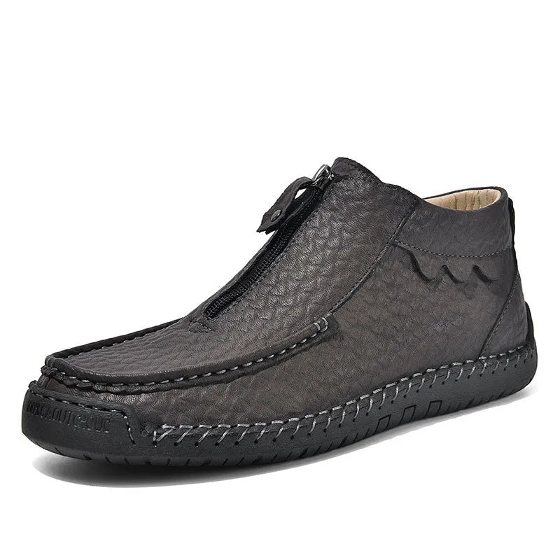 Men's black slip-on leather loafers with round toe and rubber sole on a white background