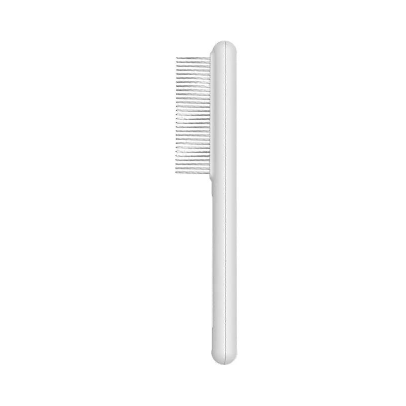 Green and white stainless steel cat comb with rounded teeth for grooming and flea removal