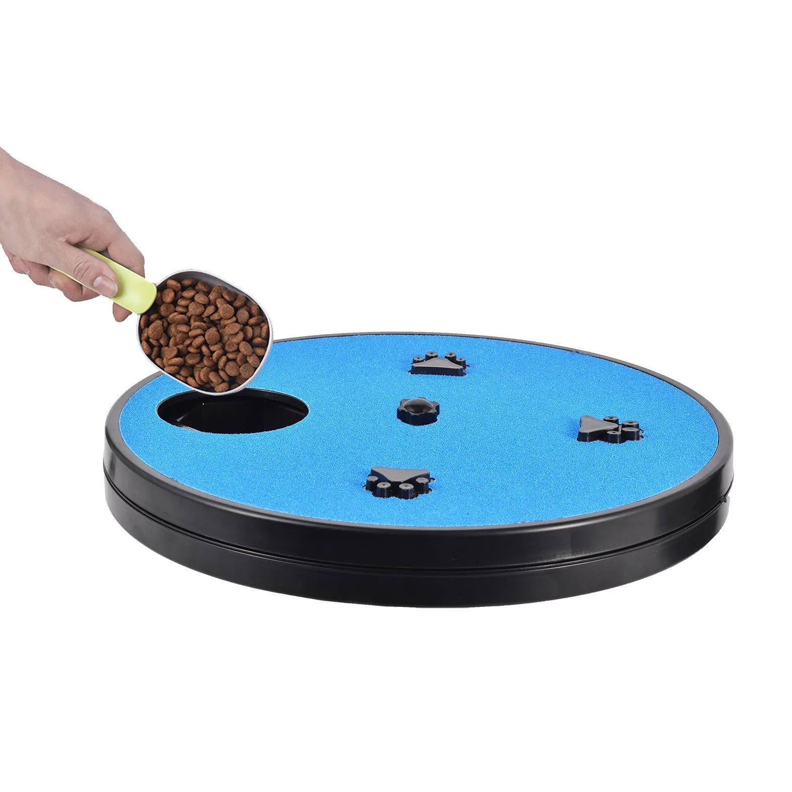 Square blue dog nail file scratching board with rotatable top and suction cup base on a wooden floor.