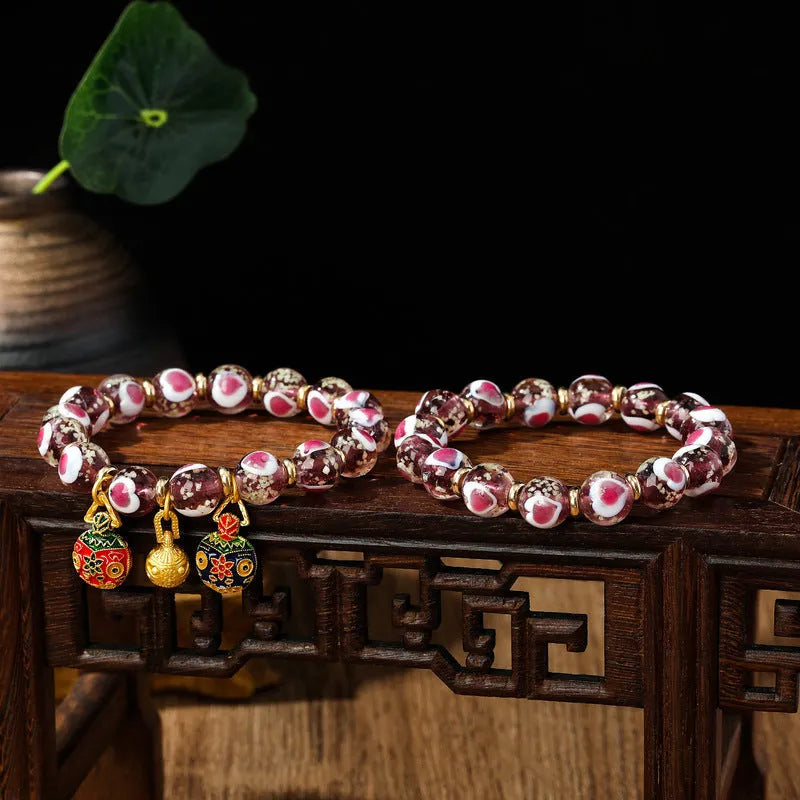 Handmade fluorescent glaze bracelet with swallowing gold beast motif on heart-shaped 10mm beads
