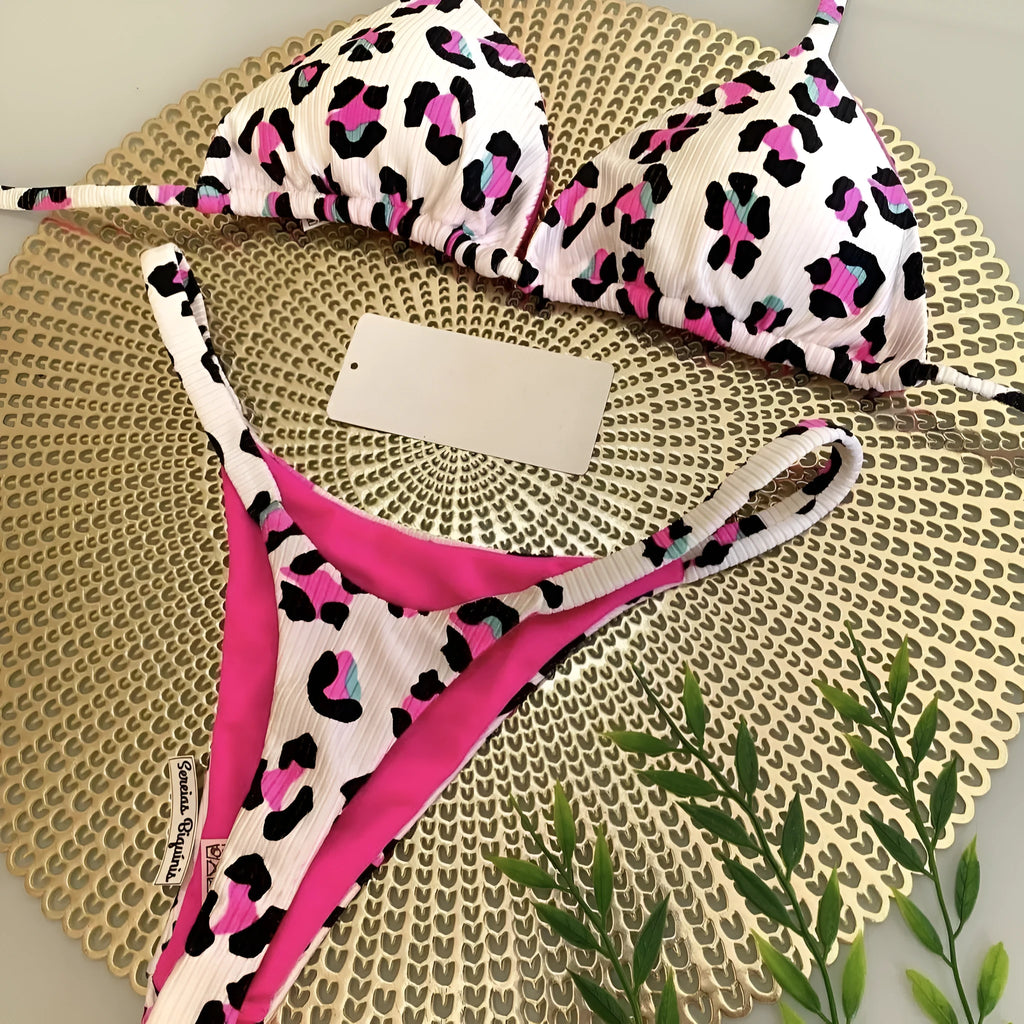 Women's printed bikini swimsuit on a hanger, showing briefs style and cotton lining detail.