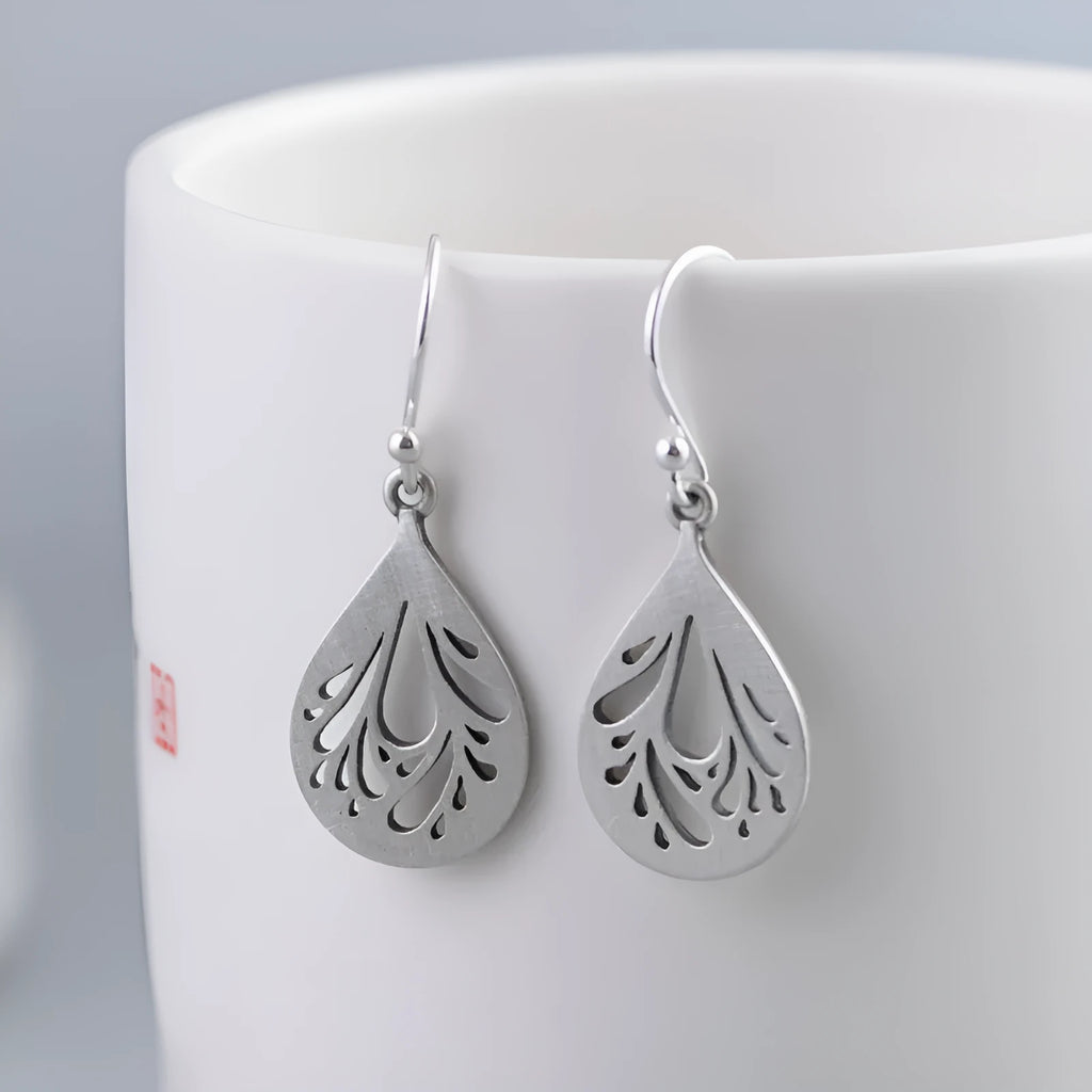 Silver hollow water drop earrings with grinding finish and retro style