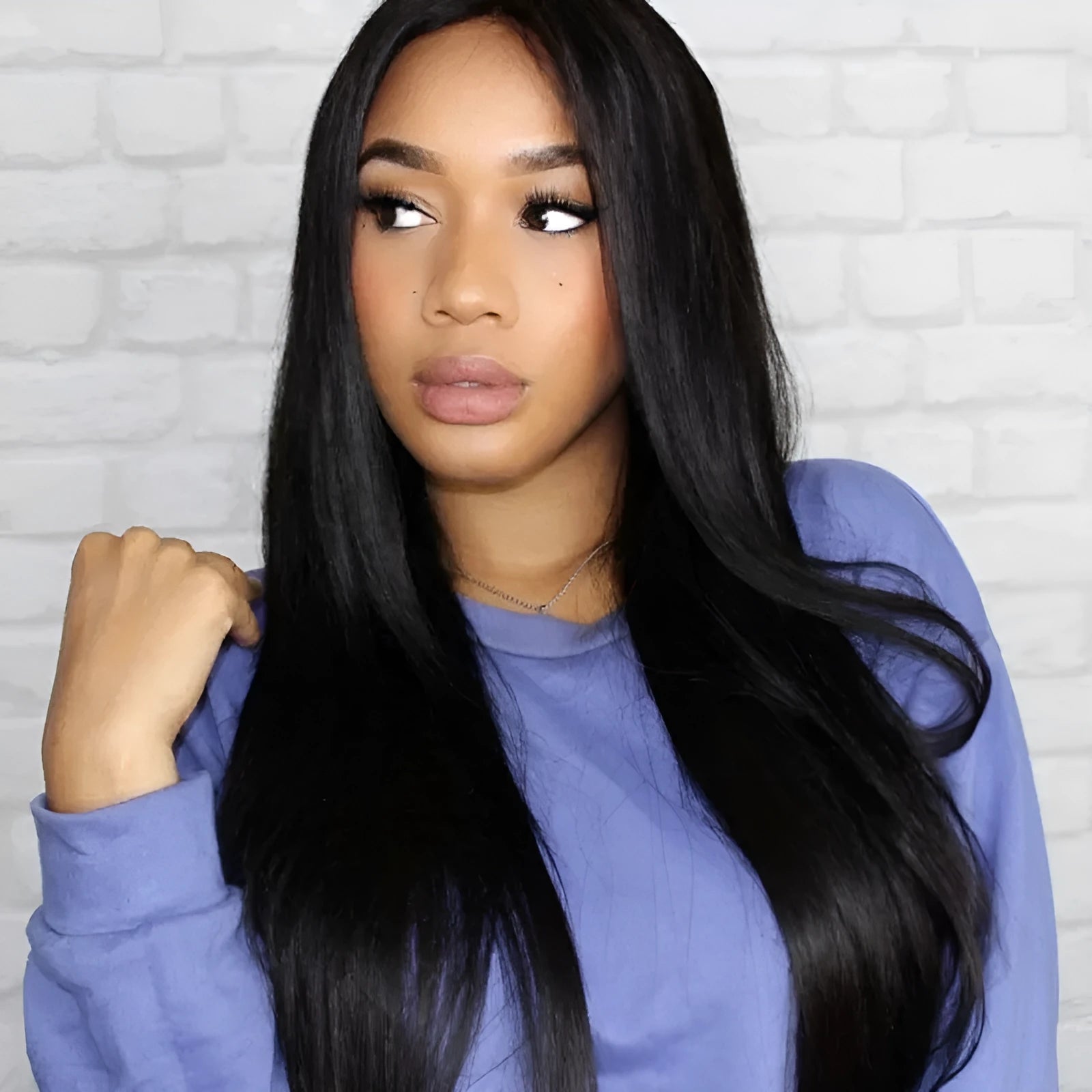 Long straight black hair wig with centre-parted bangs on display stand