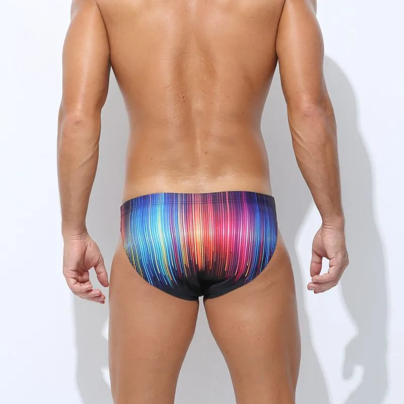 Men's printed polyester swim trunks in skull graphic design on a mannequin