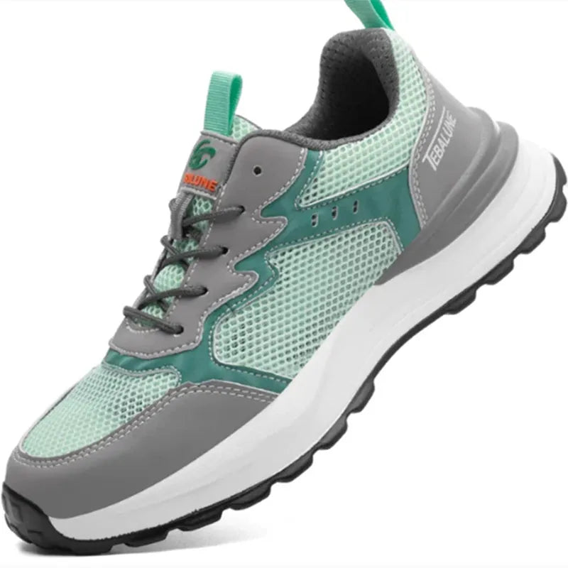 Green low-top work safety shoes with plastic toe cap, mesh upper panels, and slipper-style closure