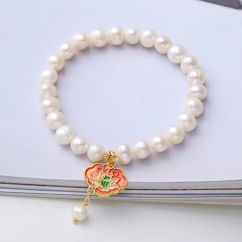 White freshwater pearl bracelet with lotus goldfish pendant in antique baroque style