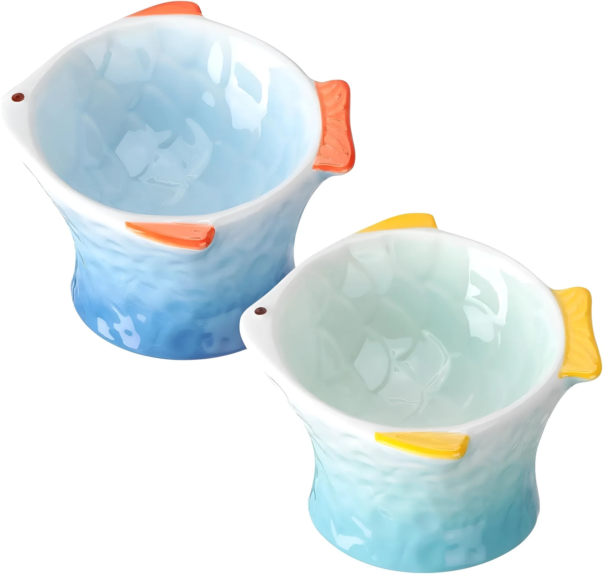 Blue fish-shaped ceramic cat bowl with tilted angle on a wooden surface