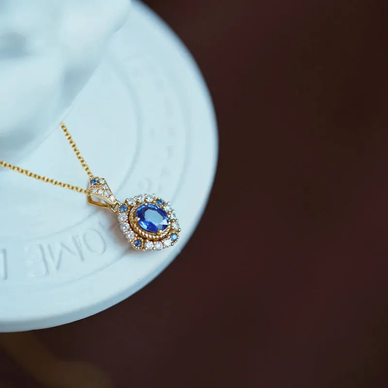 Golden royal necklace with mixed gemstone pendant on a box chain, adjustable length.