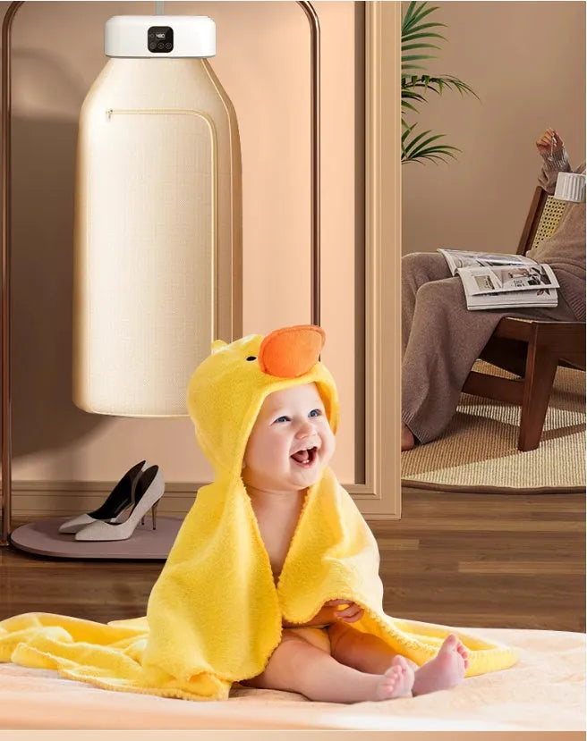 White cylindrical foldable laundry dryer with remote control for dormitory and small space use.