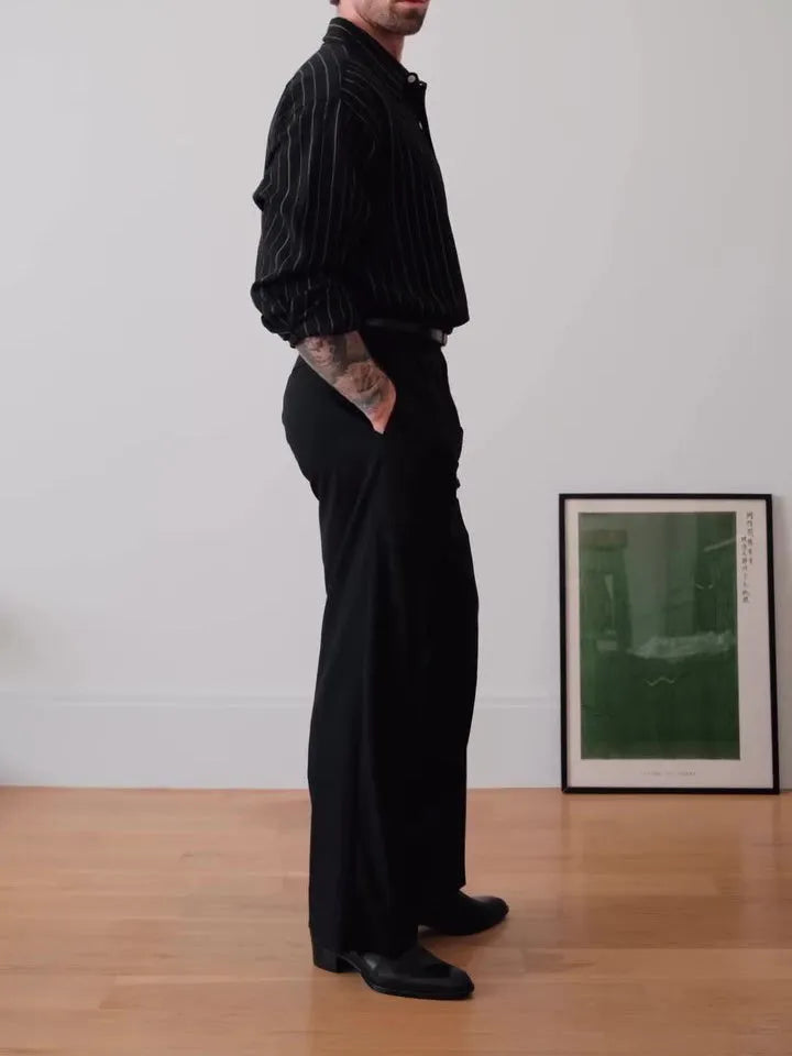 Black pinstriped button-down polyester shirt with regular fit on hanger