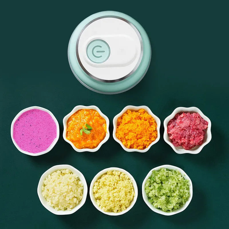 Green portable electric mini garlic cutter with transparent cup and USB charging cable