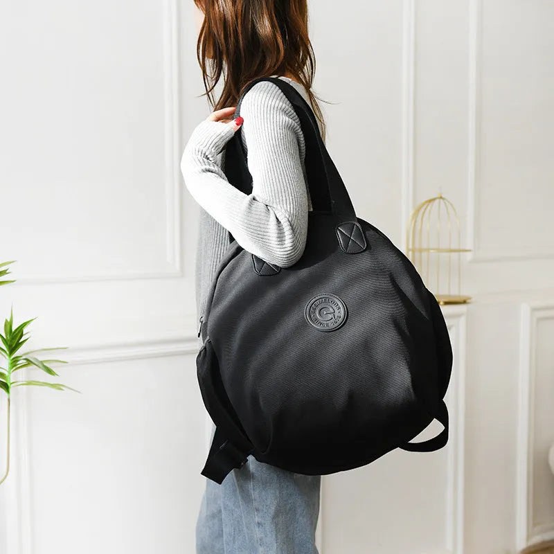 Black nylon large capacity multifunctional bag with backpack, shoulder, and handbag modes for women