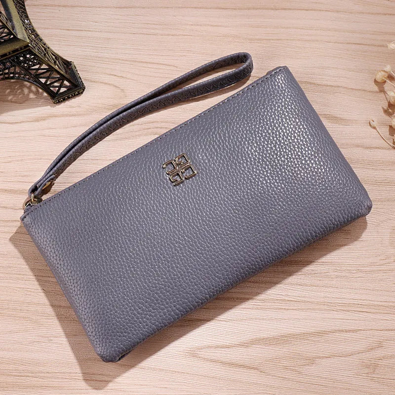 Long 55-inch strap crossbody phone wallet handbag in PU leather, shown in a solid colour.