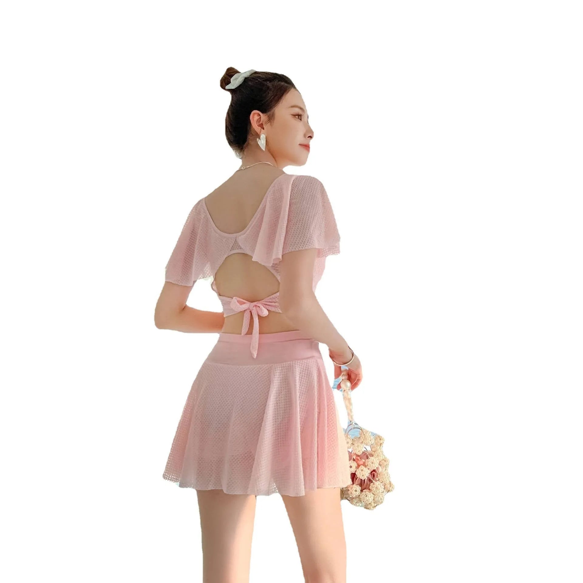 Women's solid colour two-piece skirt swimsuit set in black, white, or pink with separate top